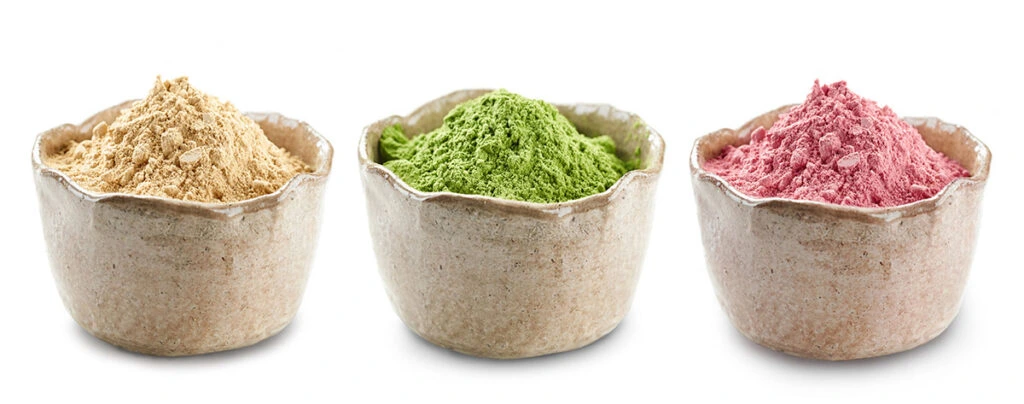 Green herbal powder extract in a bowl representing Silica and natural organic components for tissue elasticity.